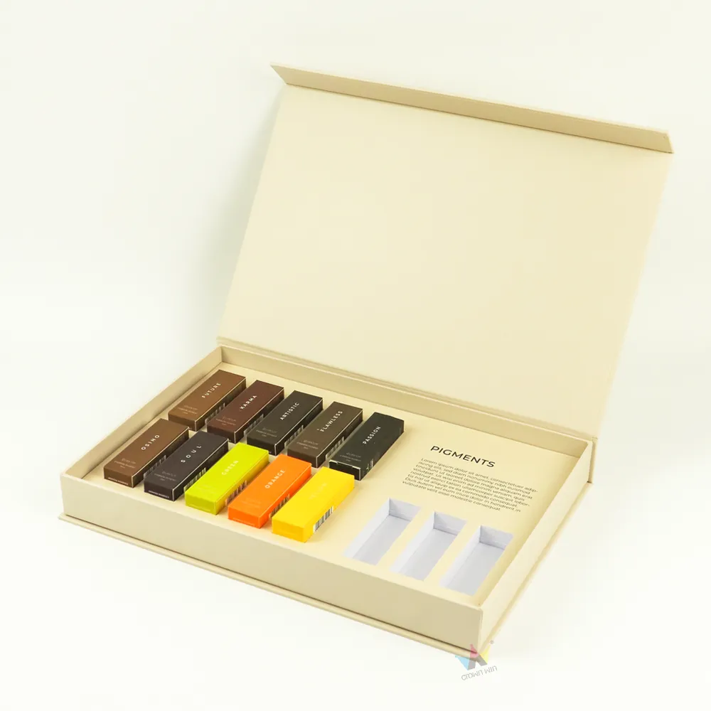 Angle shot open matte cream cosmetic boxes, showing custom tailored paper divider tray inside rigid cosmetic gift boxes