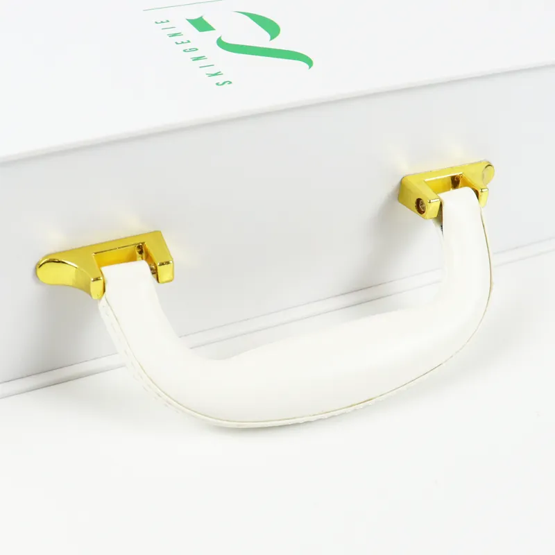 Rear view of white magnetic closure boxes with custom printed green brand logo for skincare gift packaging