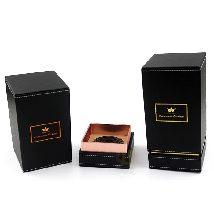 Front close-up of black stitched PU leather candle boxes with bright shiny custom gold hot foil framed crown logo and brand text
