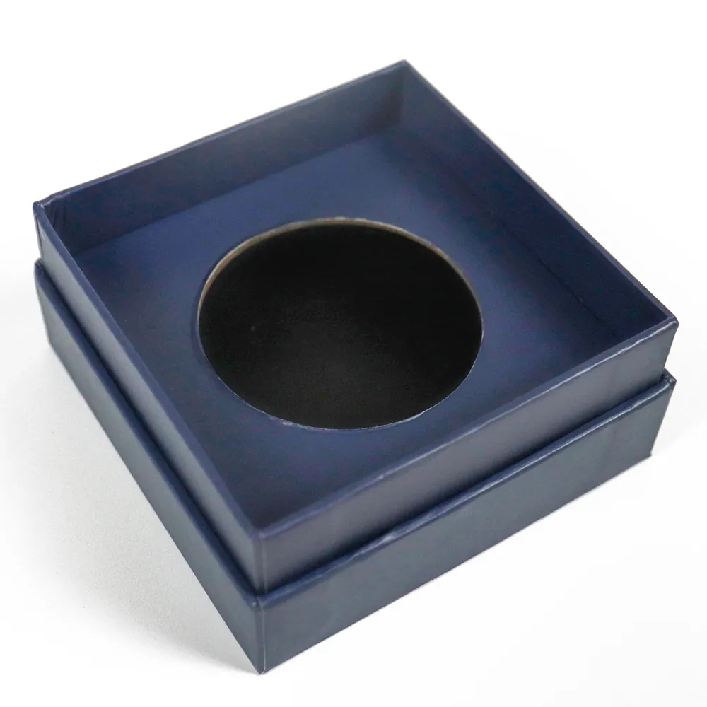 Top close-up view of custom circular recessed cavity insert inside the rigid base of the perfume lid and base box