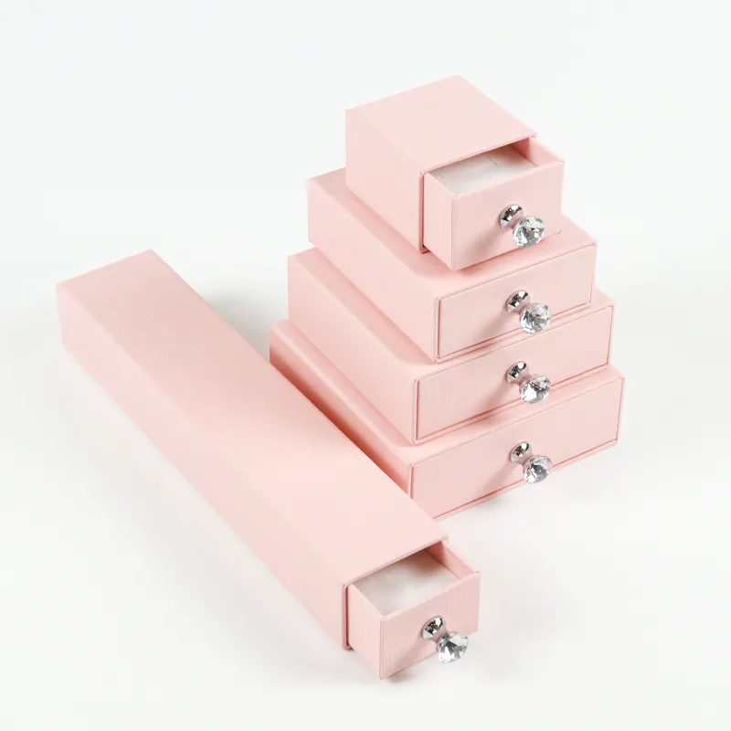 Macro close-up fine cross linen embossed texture surface on pastel pink rigid drawer box exterior
