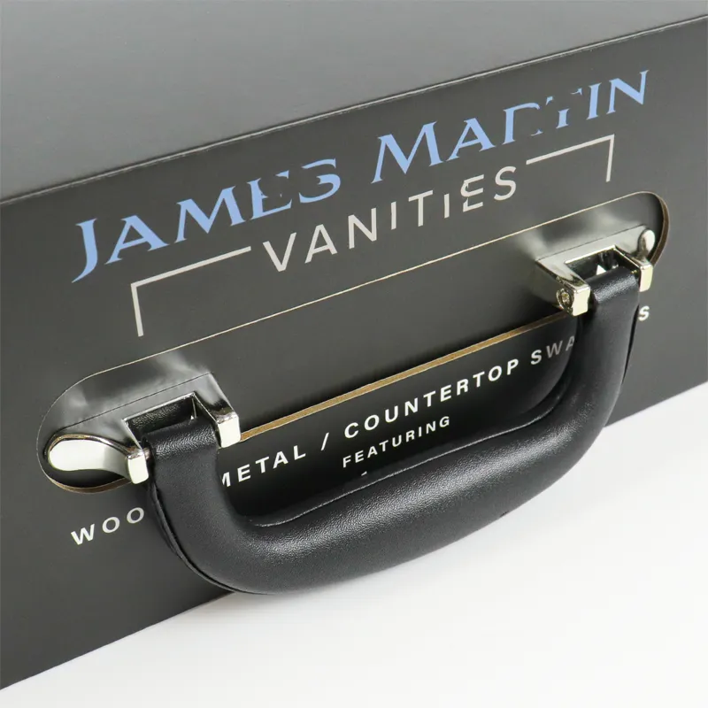 Macro close-up soft PU leather grip handle with polished silver metal mounting hardware on matte black custom printed magnetic closure boxes