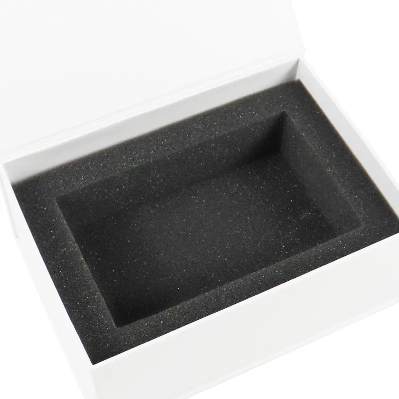 Close-up of elegant custom gold foil lotus logo printed on white magnetic box lid