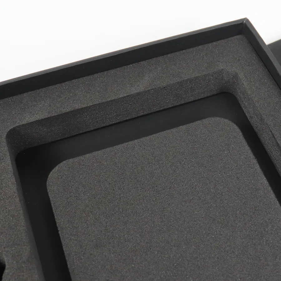 Closed matte black double door rigid box with gold foil brand lettering, premium mobile accessory gift packaging