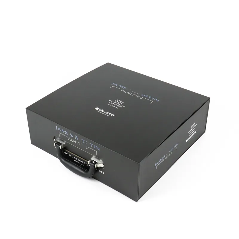Closed front overhead view matte black rigid magnetic closure boxes with branded blue print logo and integrated transport handle
