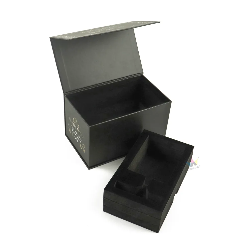Closed luxury rigid cosmetic boxes covered in vintage floral gold foil emblem and brand printing, full front view