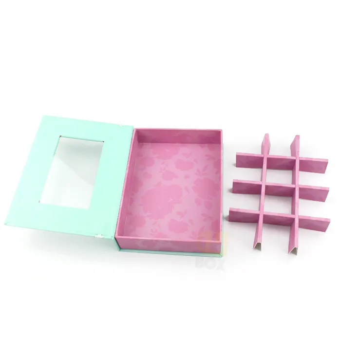 Closed book style window box packaging with decorative white lace spine trim and clear transparent PVC viewing window