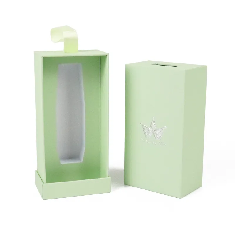 Closed pastel light green slide drawer cosmetic boxes with silver hot foil crown logo, rigid skincare bottle cosmetic packaging