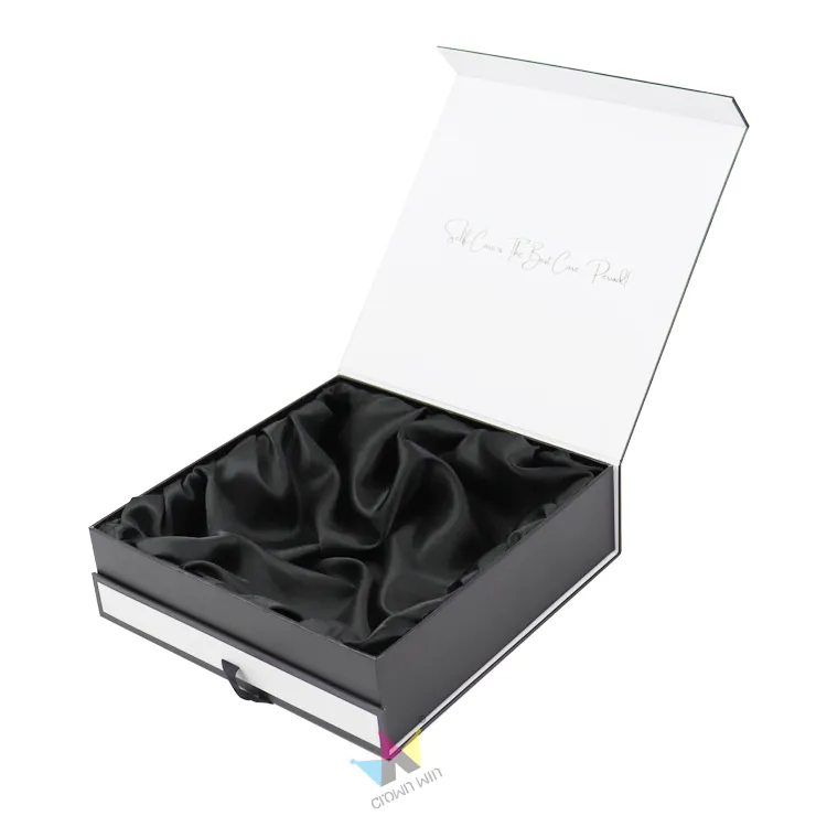 Closed minimalist rigid magnetic gift box tied with black satin ribbon, custom printed brand logo on lid