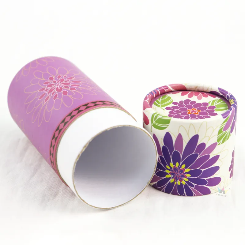 Closed front view elegant purple floral cylinder boxes, round paper tube packaging for cosmetic and gift goods