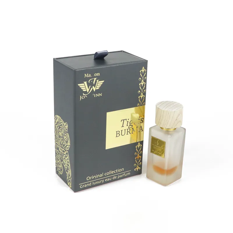 Closed red luxury perfume boxes printed with gold foil Eiffel tower and brand logo, paired with frosted glass wood-cap perfume bottle