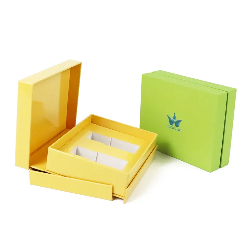 Closed rigid solid color essential oil gift boxes side by side, featuring holographic iridescent foil crown logo on front lid surface