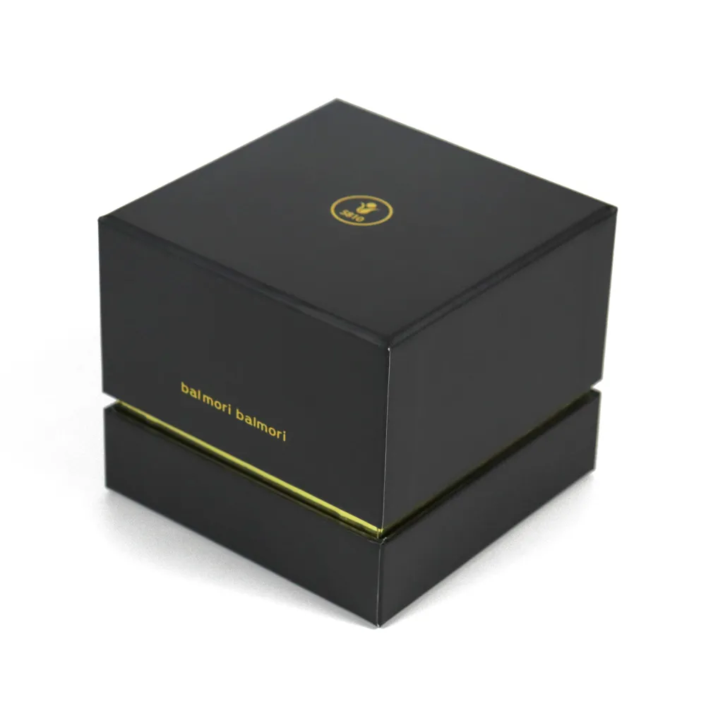 Closed square two-piece lid base matte black essential oil boxes with gold foil hot stamped brand text and circular emblem on front panel