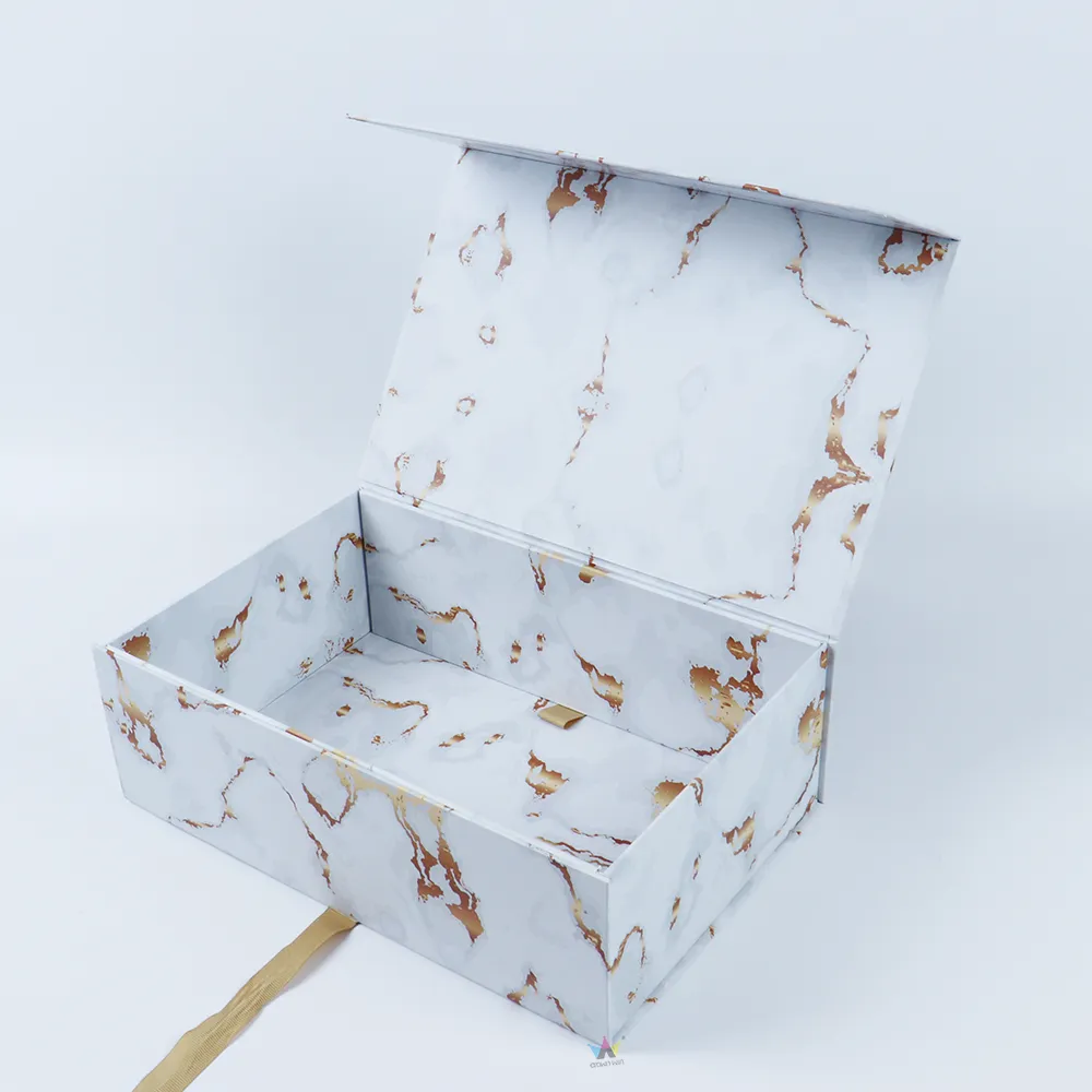 Closed white gold marble one-piece folding magnetic box with custom brand sticker label on marble printed surface