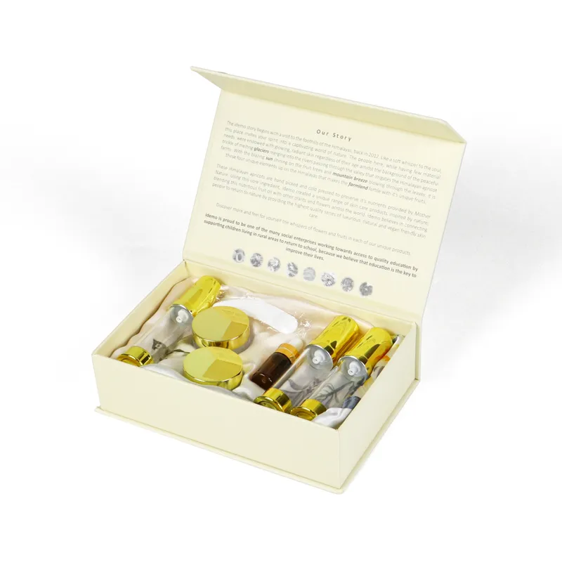 Closed front view luxury skincare packaging box decorated with champagne satin ribbon bow and gold foil logo, magnetic flip lid skincare packaging for travel sets