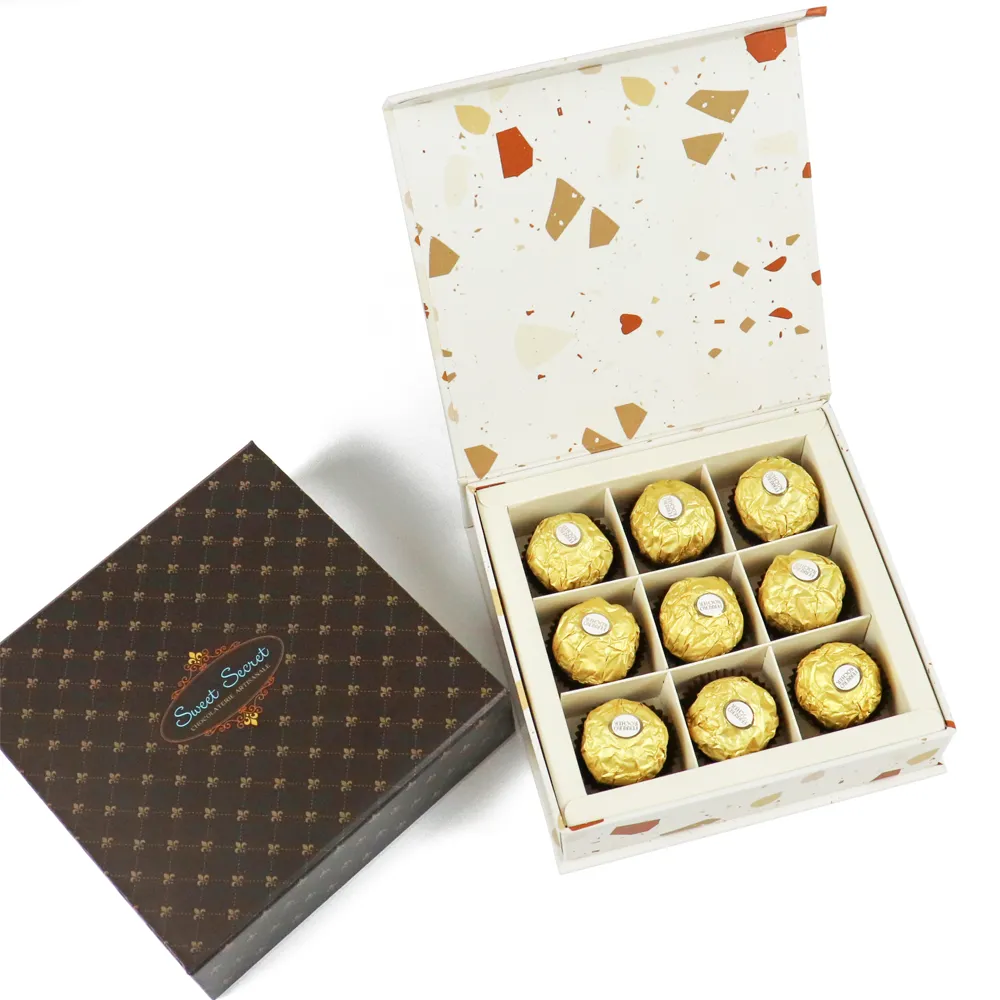Closed dark brown logo printed rigid magnetic box placed next to fully assembled open magnetic chocolate gift packaging box with segmented inner tray