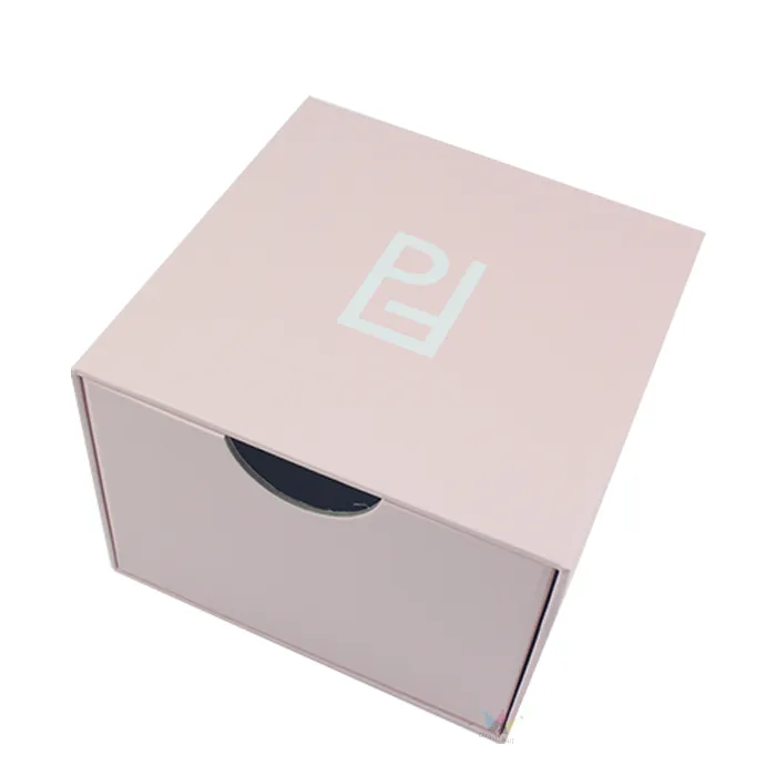 Two different sizes of opened pink slide drawer essential oil boxes displaying empty drawer compartment and finger pull cutout