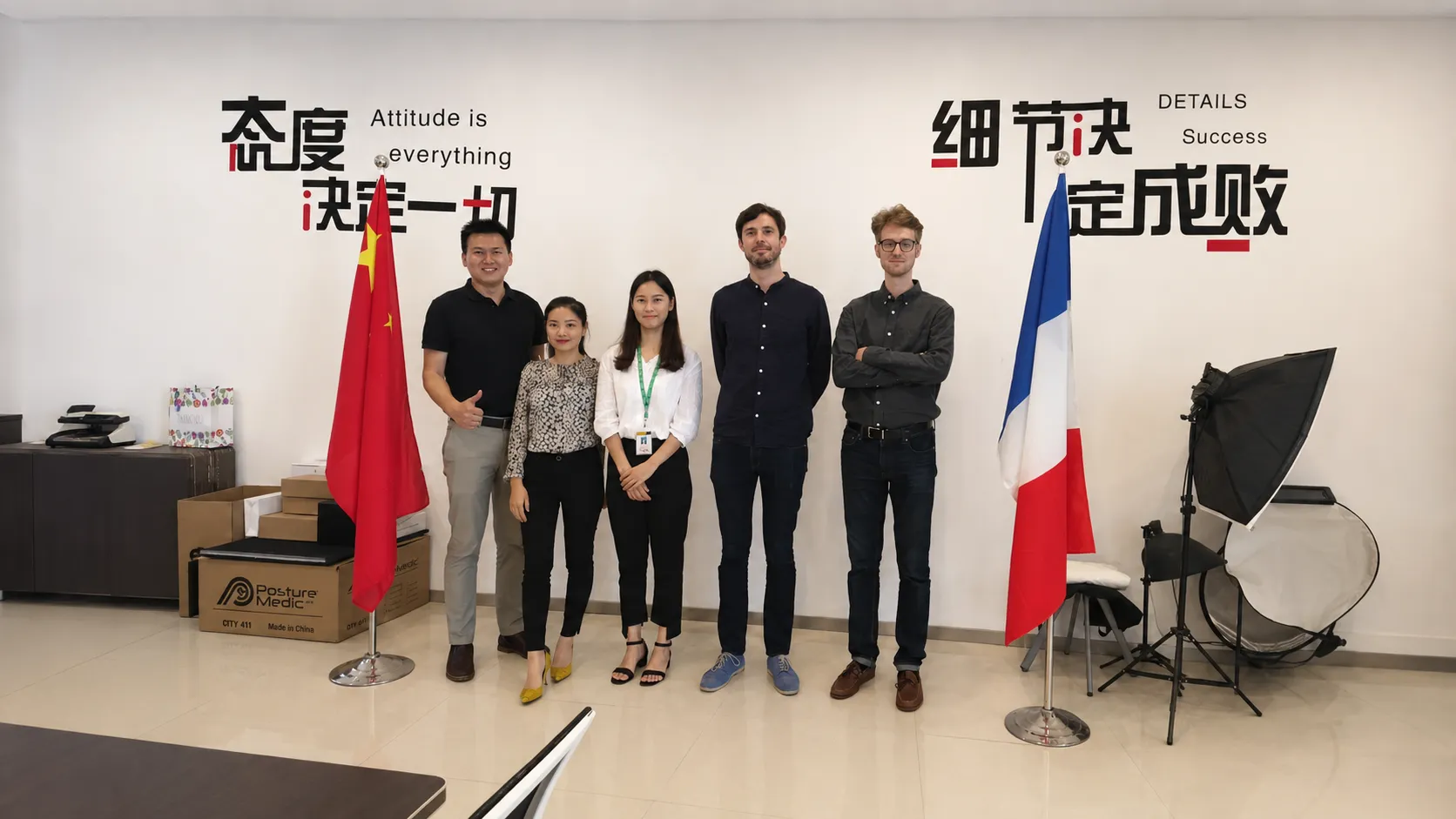 Chinese sales team and French buyers group photo at Crown Win Box Manufacturer office with China and France flags, custom paper packaging factory client visit