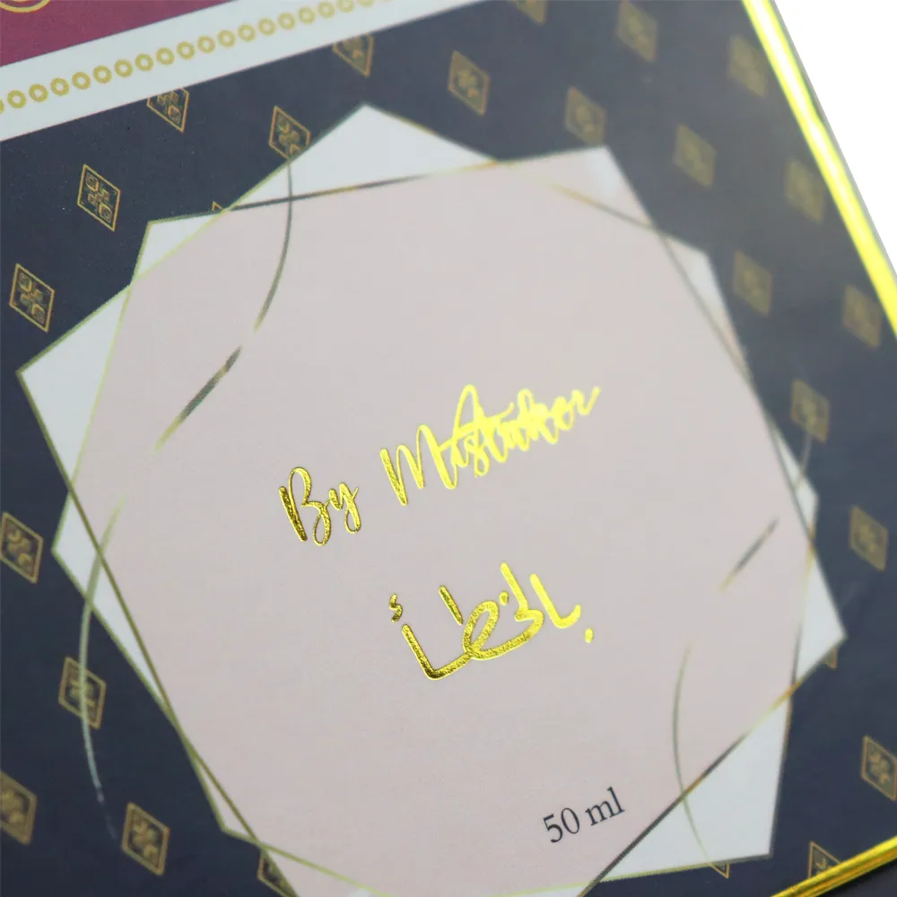 Front panel close-up of lid and base box with gold hot stamped handwritten signature and Arabic calligraphy logo print