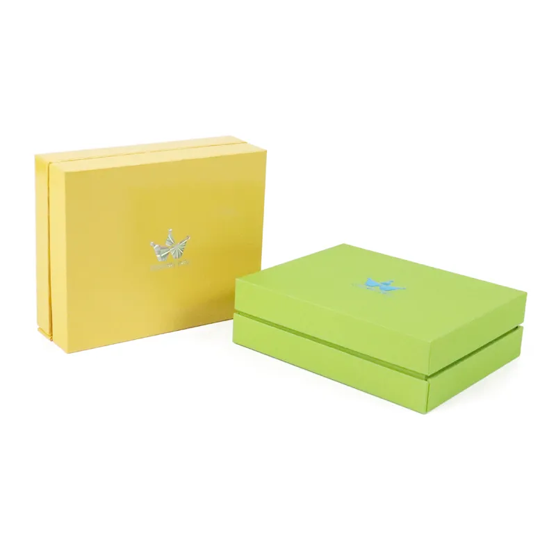 Front standing display of yellow and green magnetic essential oil boxes showcasing detailed iridescent hologram foil brand logo on lid