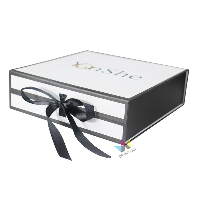 Front shot of closed black border white magnetic box with custom gold and black logo printing