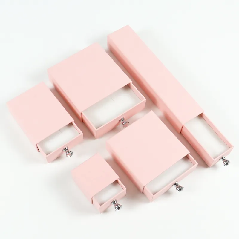 Flat lay full set of 5 sizes pink linen texture rigid drawer box with crystal pull knobs, velvet lined jewelry drawer box collection
