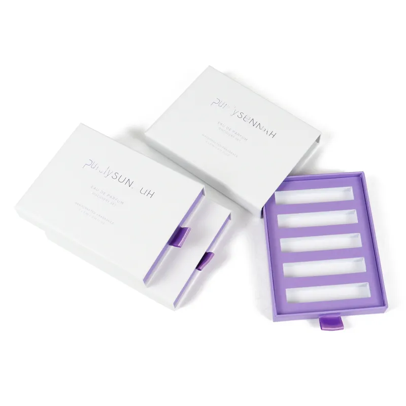 Top-down overhead shot of fully pulled empty 5-slot rigid drawer box, purple inner tray for perfume trial vials storage
