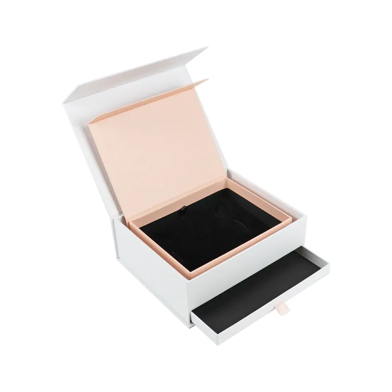 Fully opened blush pink flip box inside cosmetic boxes, revealing soft black velvet molded jewelry storage tray insert