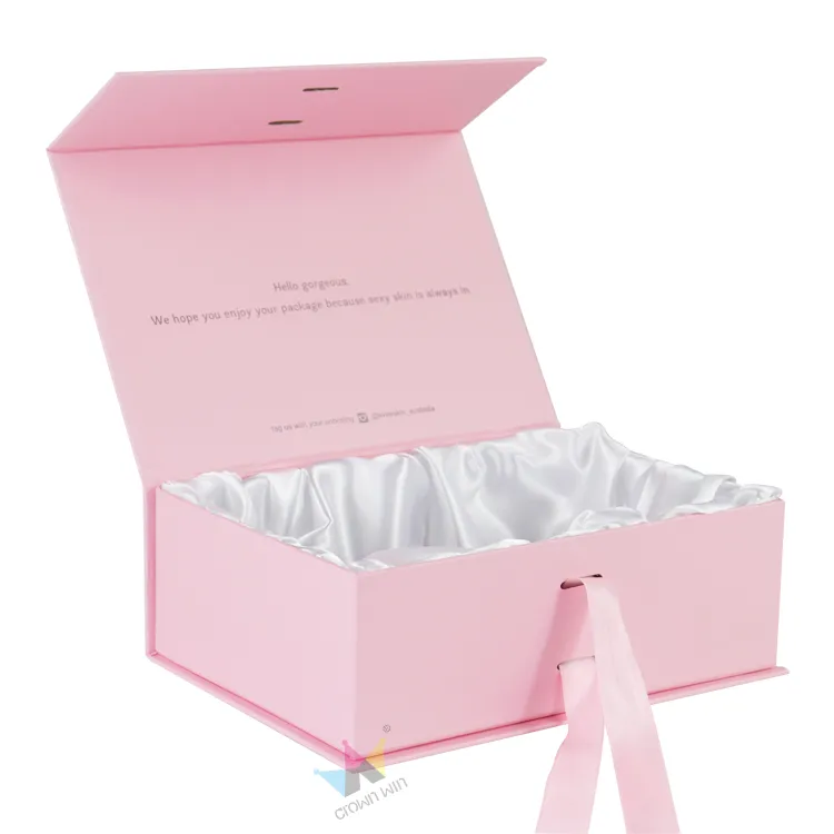 Fully open blush pink magnetic box showcasing fluffy gathered white silk satin lining and personalized printed text on inner flip lid