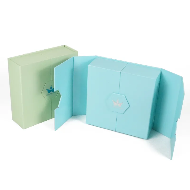 Fully unfolded flat double door box displaying empty pre-cut dual-bottle white EVA foam insert, eco foldable cosmetic packaging