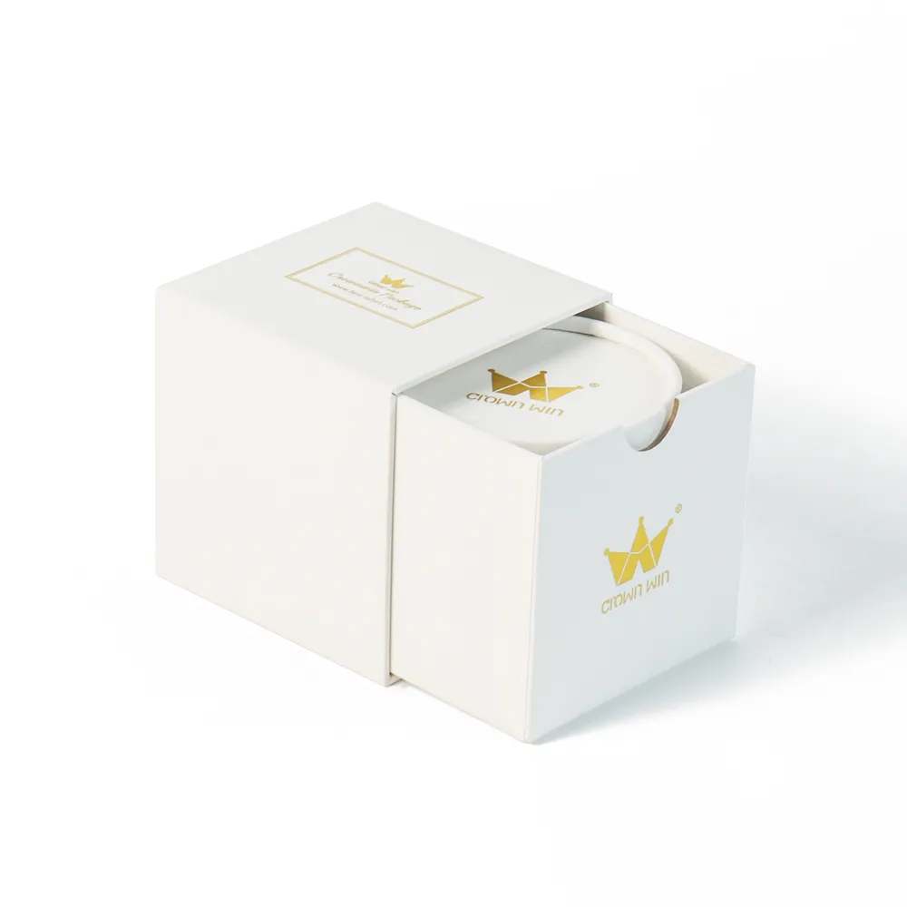 Half pulled open matte white slide drawer candle boxes holding matching branded round paper candle tube insert