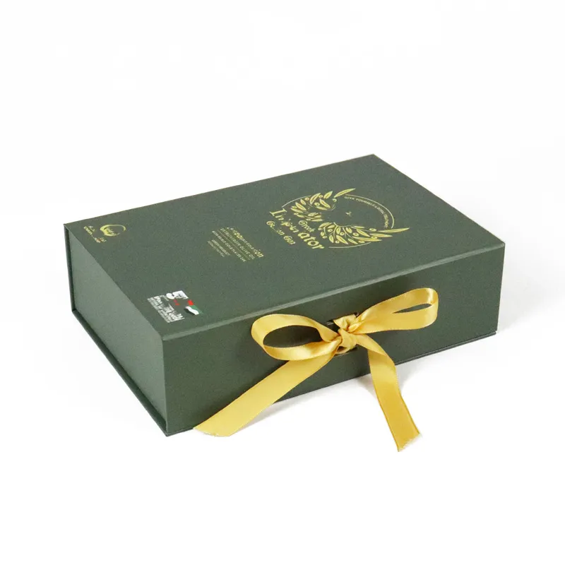 Interior detail of soft gathered golden satin cushion lining inside magnetic closure gift box