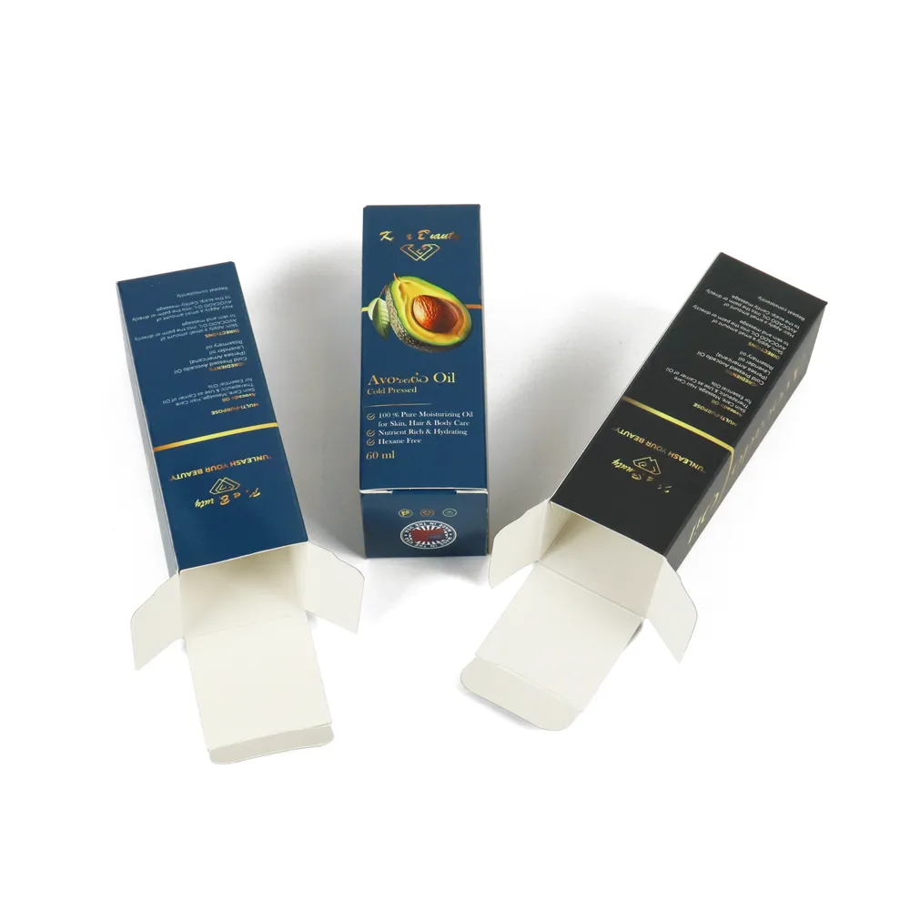 Display of die-cut flat blanks and fully assembled long tuck folding cartons for cosmetic oil packaging