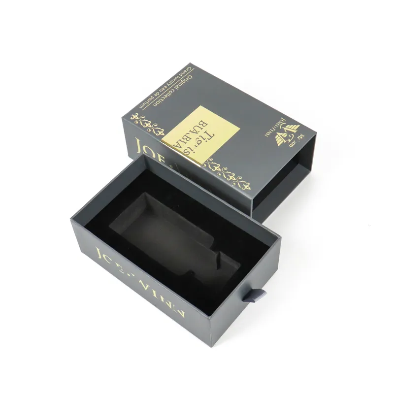 Open dark grey matte slide drawer perfume boxes with gold foil tiger artwork, empty tailor-cut black EVA foam liner inside rigid fragrance packaging