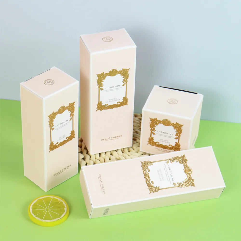 Flat die-cut blanks paired with assembled beige reverse tuck folding cartons for face cream packaging