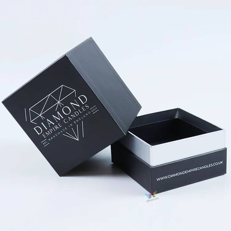 Opened lid and base essential oils boxes fitted with custom deep circular black foam insert for scented candle jars, protective essential oils packaging boxes