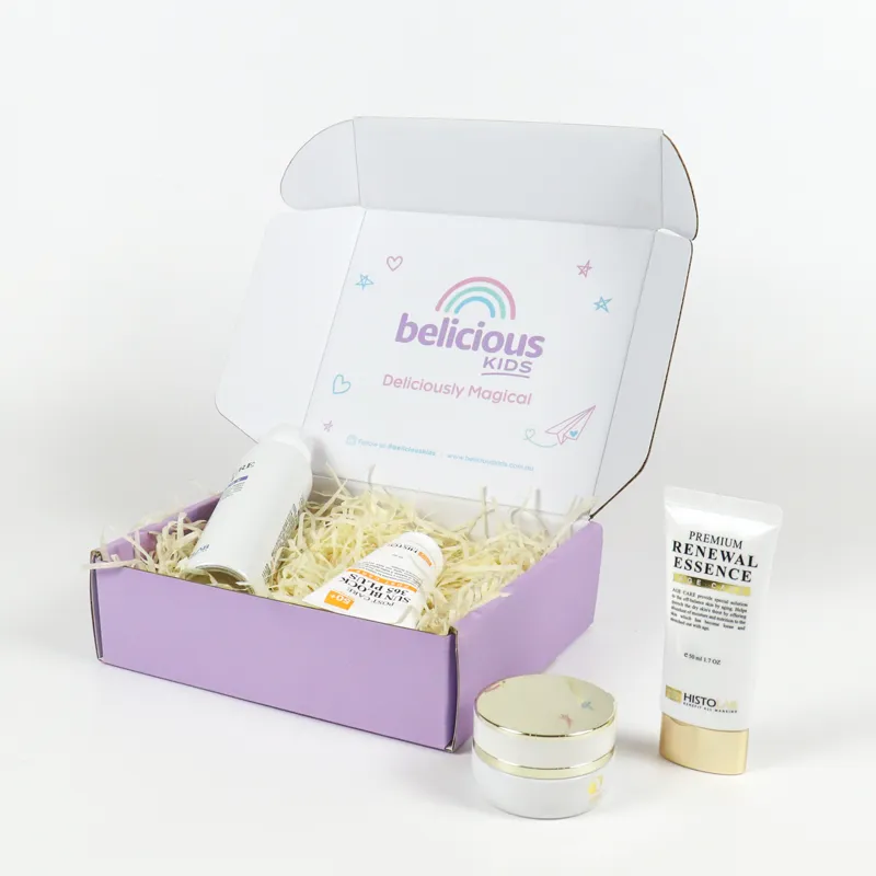 Open lilac mailer tuck folding cartons filled with shredded paper filler holding skincare mist and sunscreen tubes, custom interior print cosmetic gift tuck folding cartons