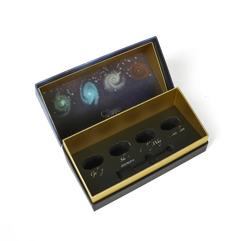 Open magnetic closure rigid box showing neatly placed nail polish bottles inside precision die-cut tray