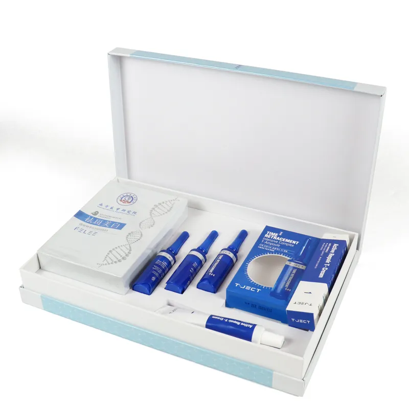 Open magnetic rigid skincare packaging set box, equipped with custom molded EVA insert holding ampoules, facial mask boxes and repair cream tubes