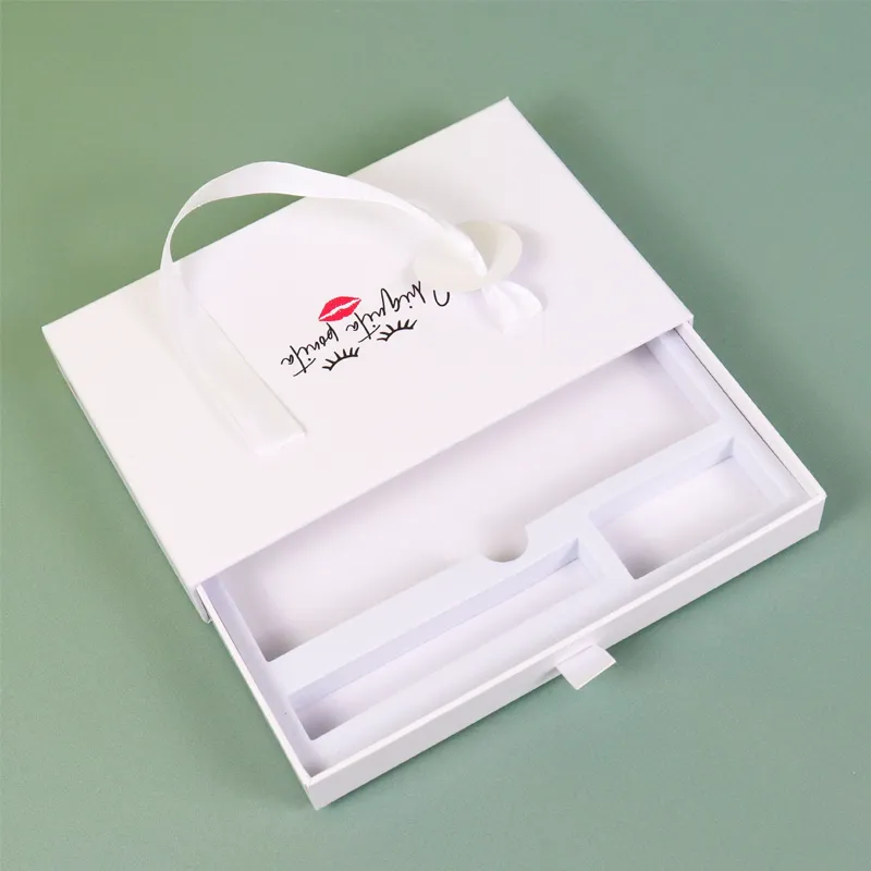 Open white slide drawer cosmetic boxes, empty segmented molded white EVA foam insert inside pull-out drawer, rigid skincare gift packaging