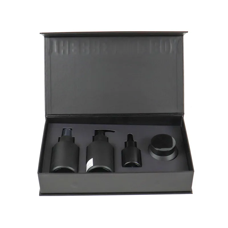 Overhead open view of empty fitted shockproof EVA foam tray inside luxury matte black cosmetic boxes gift set packaging