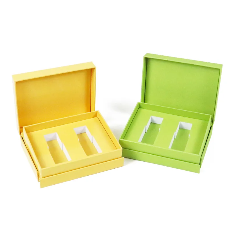 Top-down overhead interior shot of green magnetic essential oil boxes with tailor-made two-bottle separating paper divider cavities