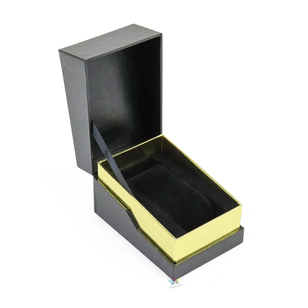 Top-down overhead interior shot of rigid essential oil boxes with reflective gold inner tray and smooth protective velvet liner