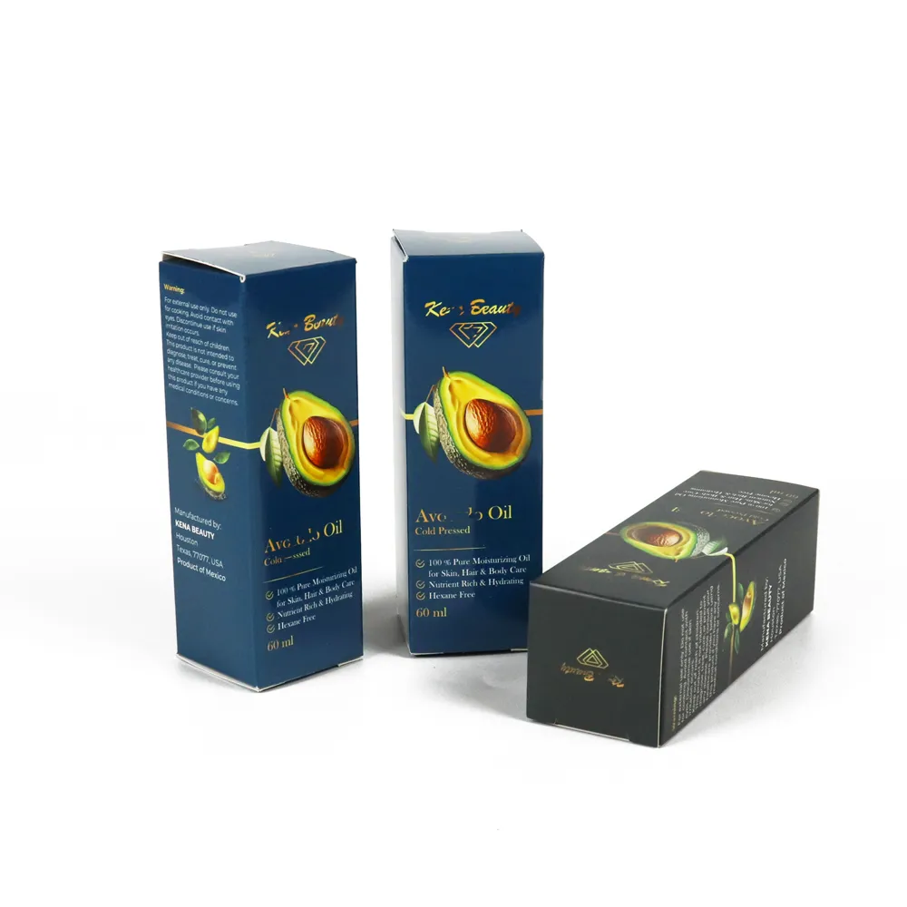 Open empty vertical tuck cartons alongside finished printed cosmetic packaging boxes for essential oils