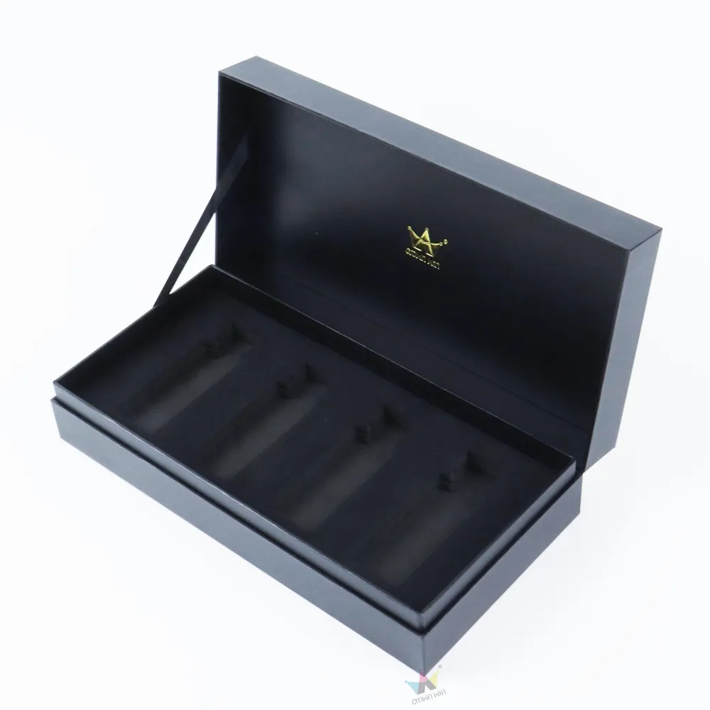 Top down overhead shot of rigid essential oil boxes with four tailor molded bottle holding cavities in soft shockproof EVA foam liner