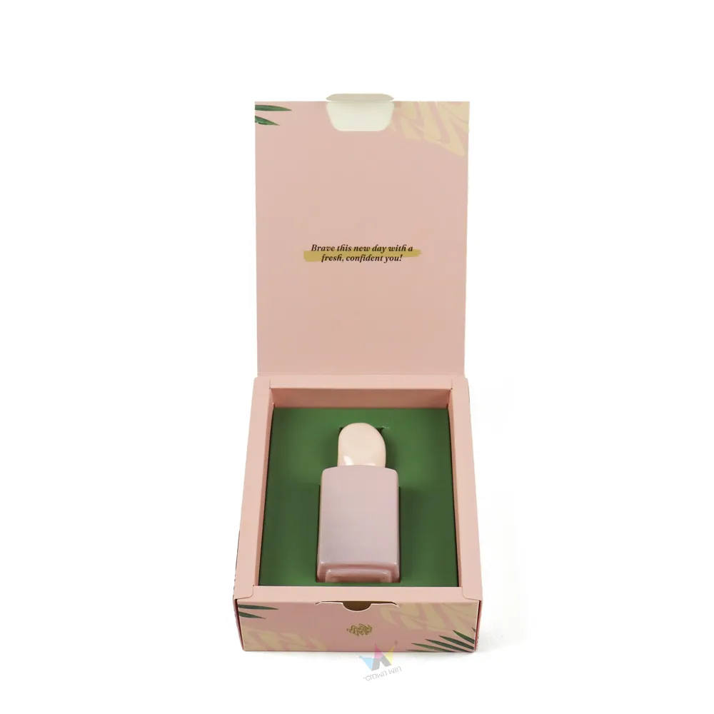 Square pink perfume bottle perfectly fitted into custom hollow paper tray inside flip top perfume box