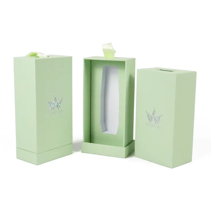 Drawer pulled open ribbon pull cosmetic boxes, empty tailor-cut white EVA foam insert inside rigid cosmetic gift boxes