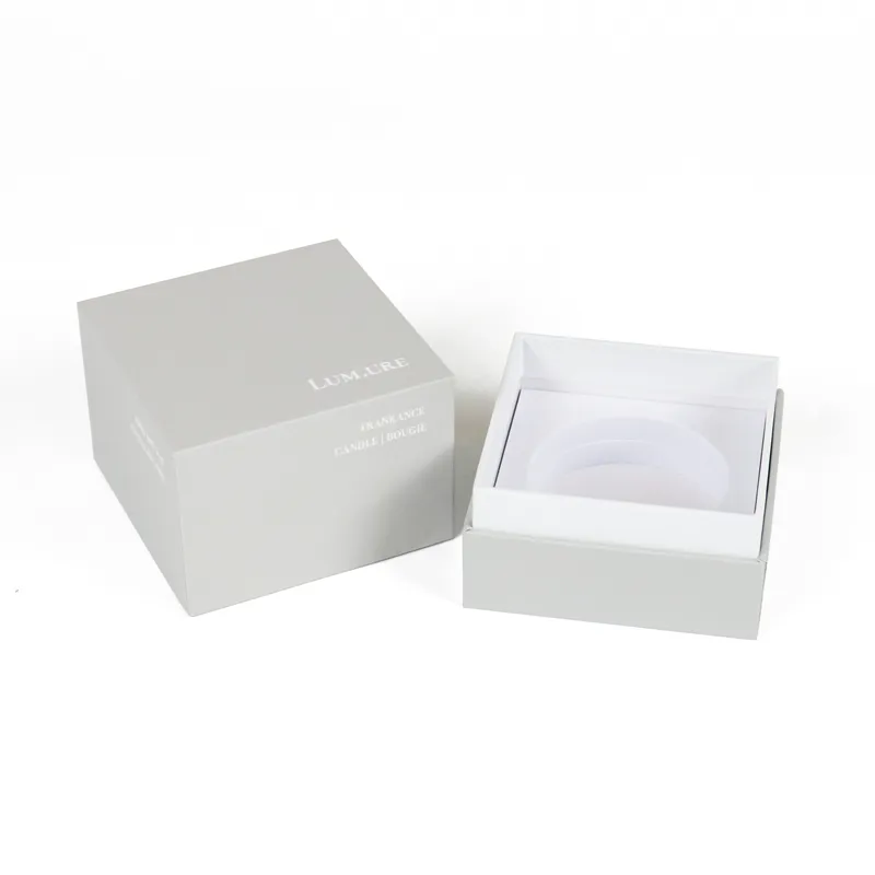 Close-up detail of custom circular recess foam insert inside square rigid candle boxes, shockproof inner lining for candle jars