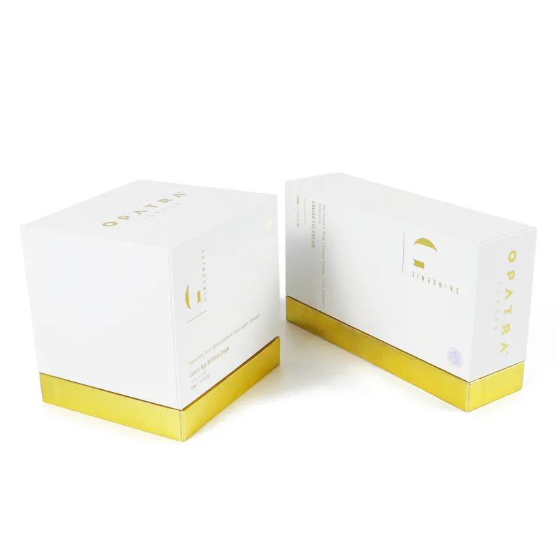 Separated lid and base view of luxury skincare packaging, showing full glossy gold metallic wrapped inner tray