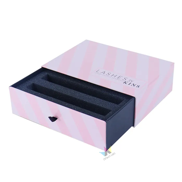 Side close-up of pink striped slide drawer box, highlight small fabric pull tab detail on rigid cosmetic drawer box